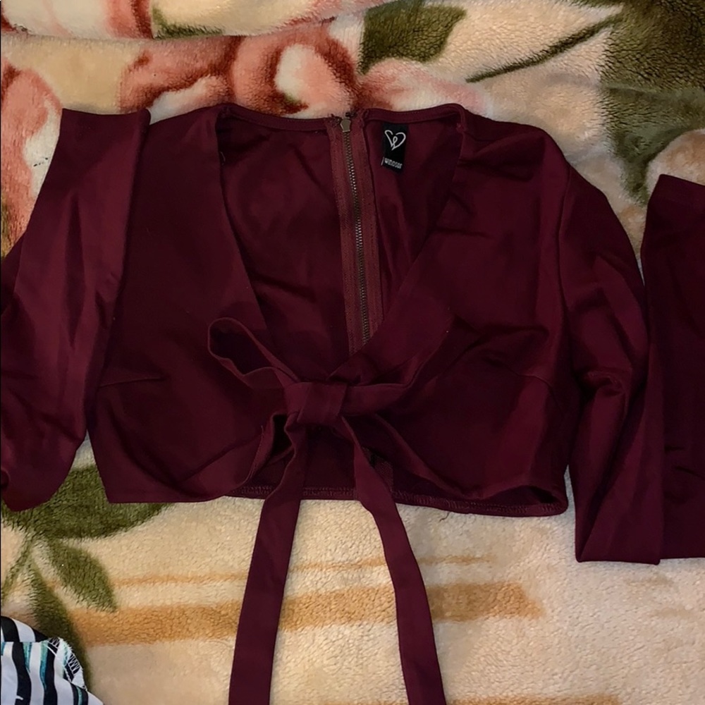 Burgundy colored open from the chest area